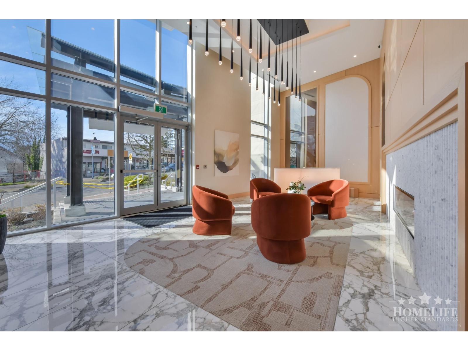 A modern living room with a large window and a marble floor.