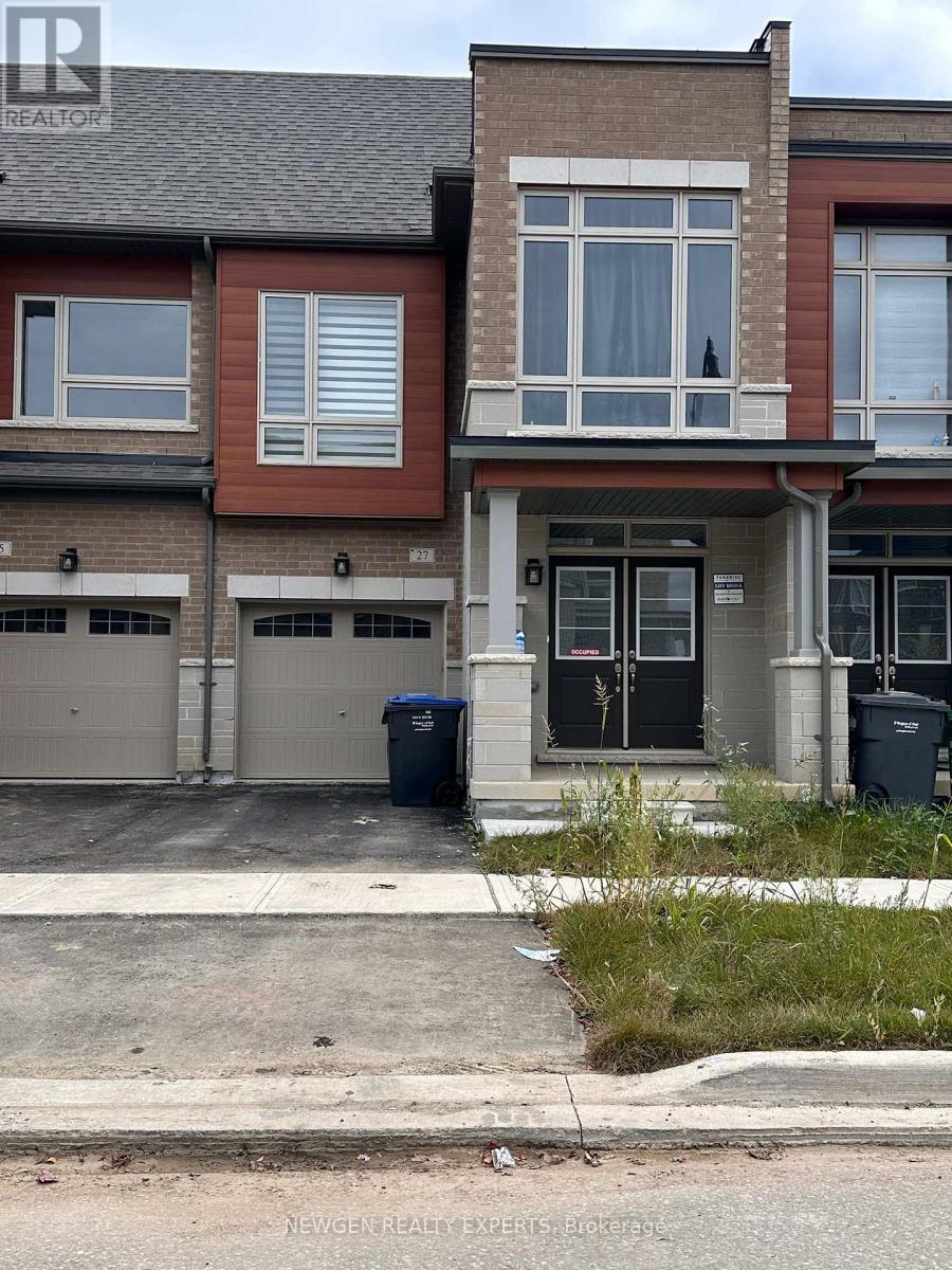 A row of houses with the front of the first one visible.