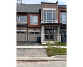 A row of houses with the front of the first one visible.