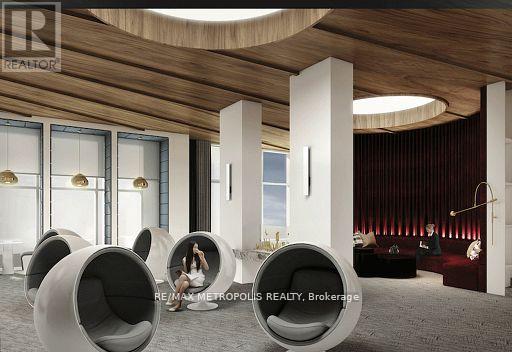 A modern living room with a person sitting in a circular chair.
