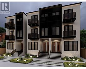 A modern two-story residential building with balconies and a front garden.