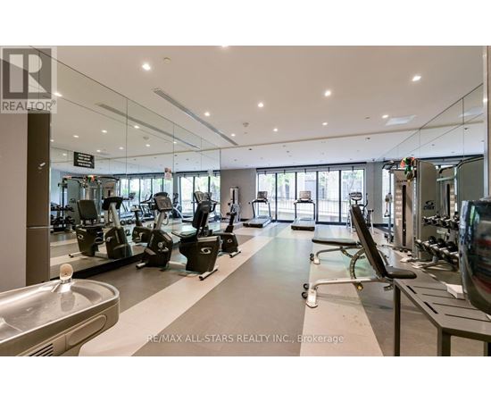 A gym with a variety of equipment is labeled RE/MAX All-Stars Realty Inc., Brokerage.