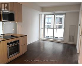 A kitchen with a stove top oven and microwave above it.