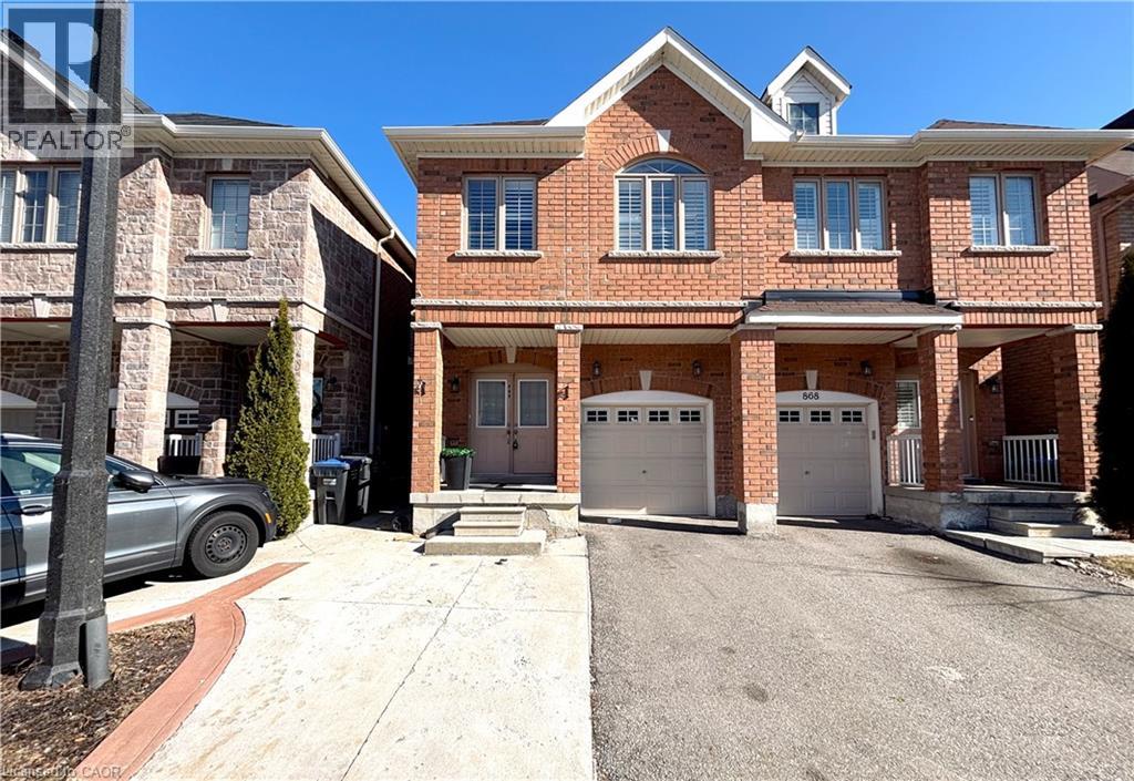 A large brick house with a garage is shown.