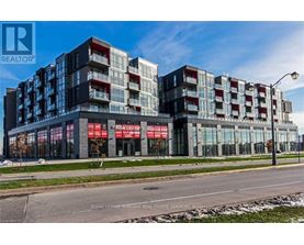 A modern multi-story building with a glass facade and a red and white sign that reads "REALTOR".