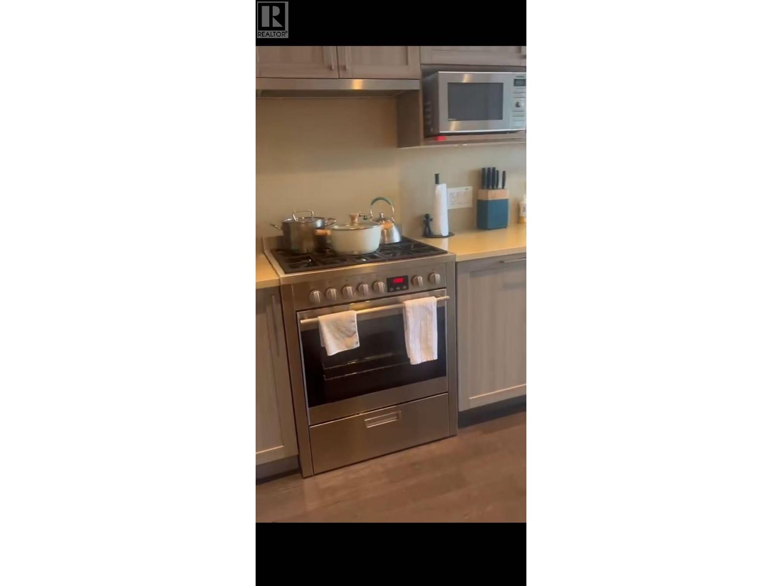 A modern kitchen with a stove and oven.