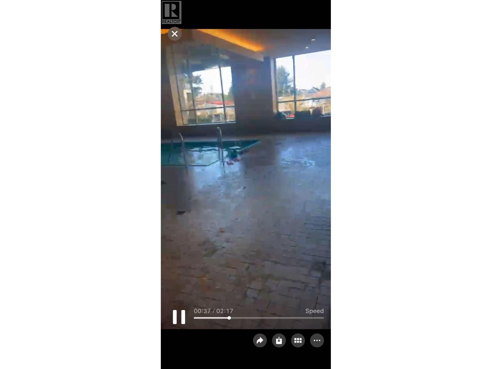 A video player with a play button in the center and a timestamp of 09:37 / 02:17 displayed.