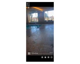 A video player with a play button in the center and a timestamp of 09:37 / 02:17 displayed.