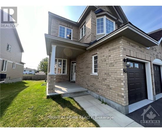 A two-story house with a garage is for sale.