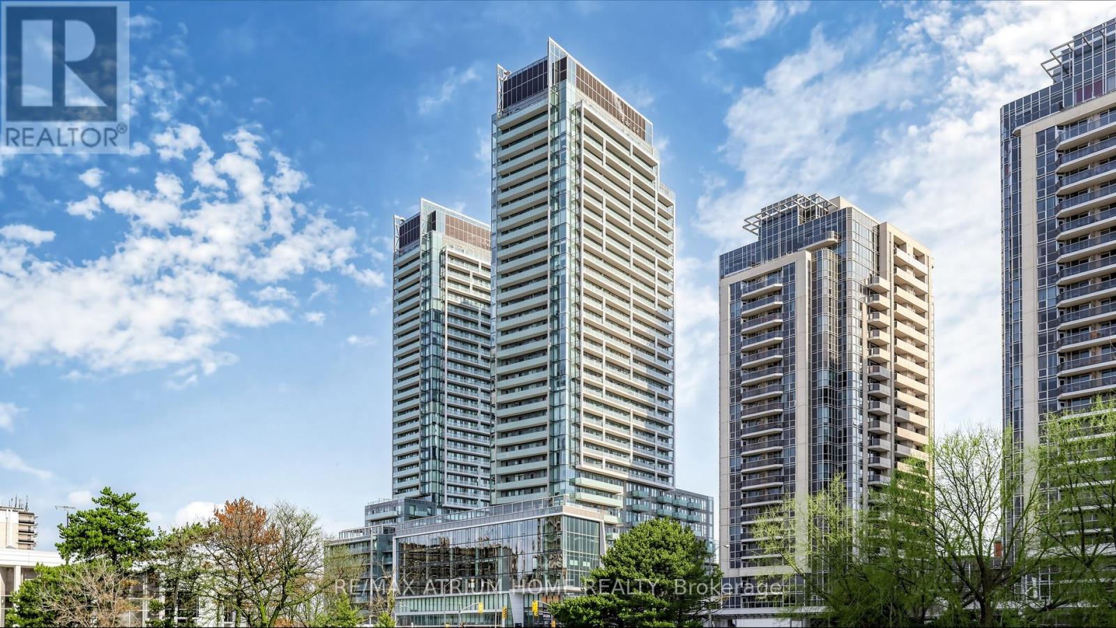 A cityscape with tall buildings and a clear sky.