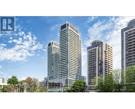 A cityscape with tall buildings and a clear sky.