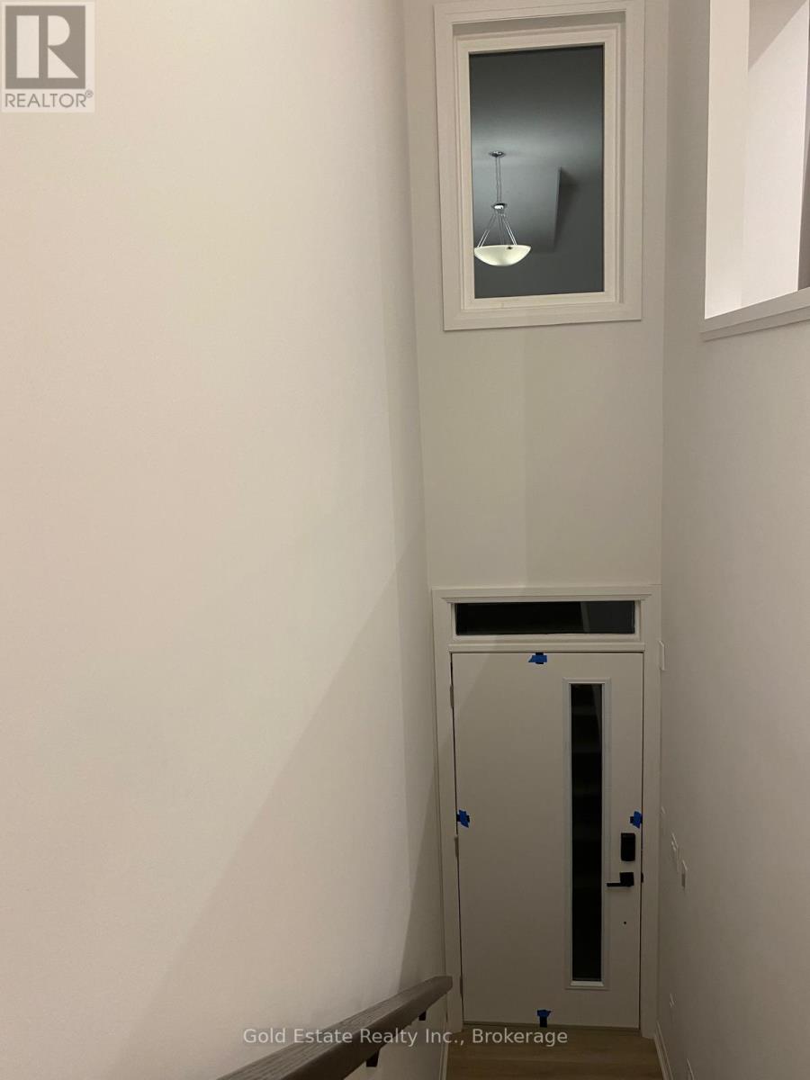A white door with a small window above it.