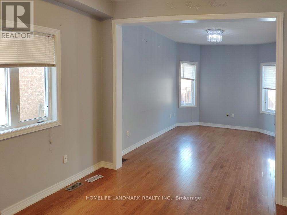 A room with wooden floors and white walls.
