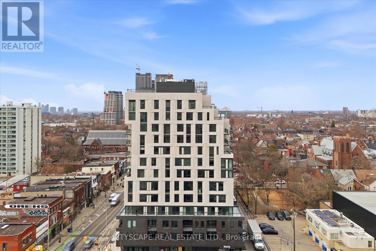 A tall building with the words "CITYSCAPE REAL ESTATE LTD" on the front.