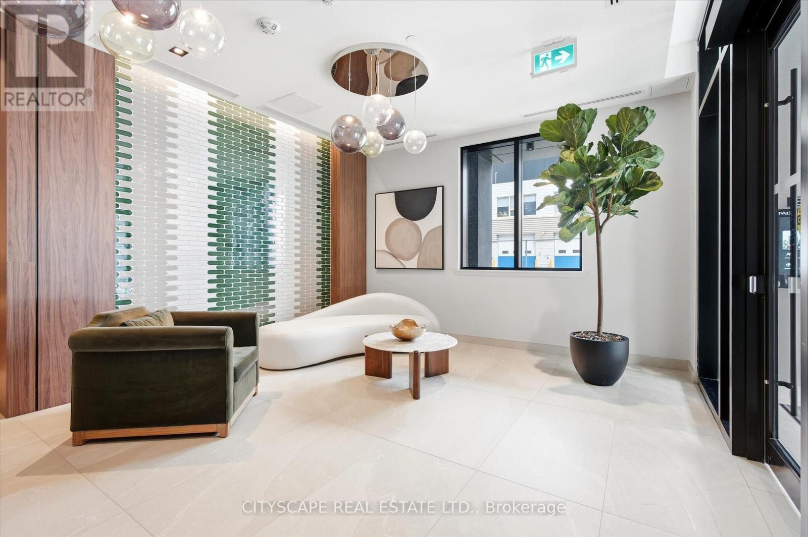 A modern living room with a green plant and a white sofa.