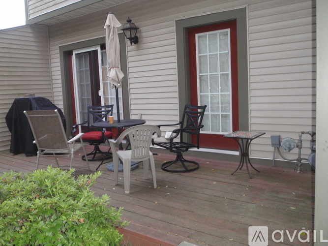 A patio with a table and chairs.