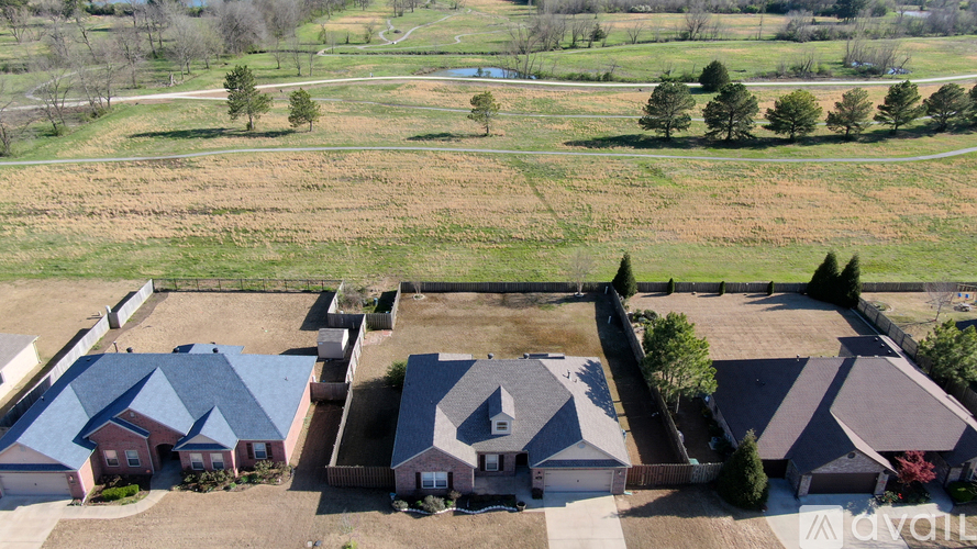 A bird's eye view of a residential area with houses and trees.