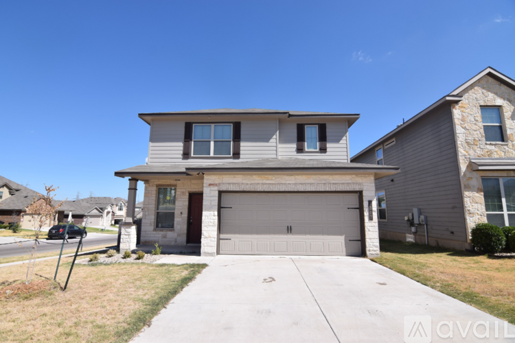 A house with a garage is for sale.