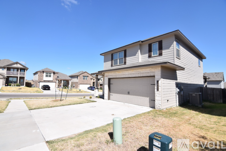 A house with a garage is for sale.