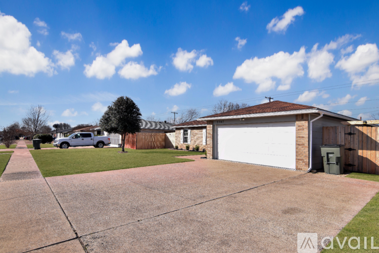 A house with a white garage door is for sale.