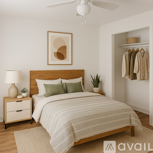 A bedroom with a bed, nightstand, and a wall-mounted closet.