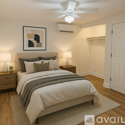 A bedroom with a bed, nightstands, and a ceiling fan.
