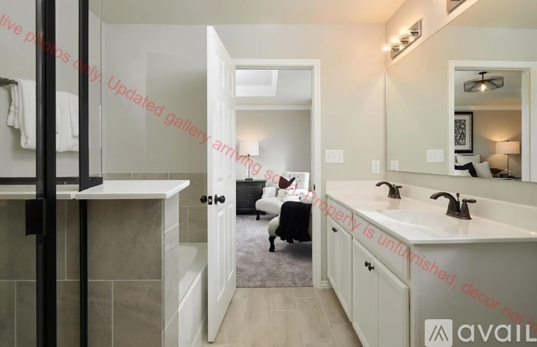 A bathroom with a white sink and a mirror above it.