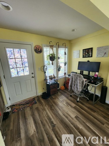 A room with a desk and a chair.