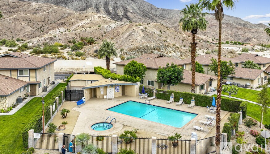 A large house with a pool in the backyard.
