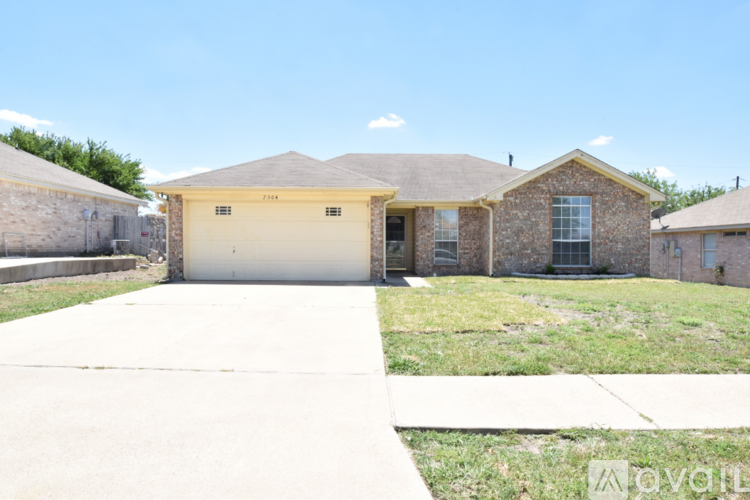 A house with a garage is for sale.
