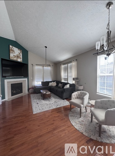 A living room with a fireplace and a couch.