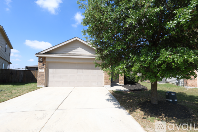A house with a garage and a driveway.