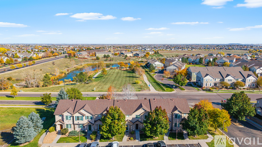 A bird's eye view of a residential neighborhood with houses and trees.