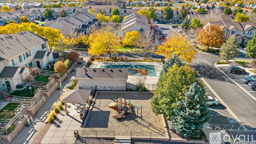 A bird's eye view of a neighborhood with houses and a playground.