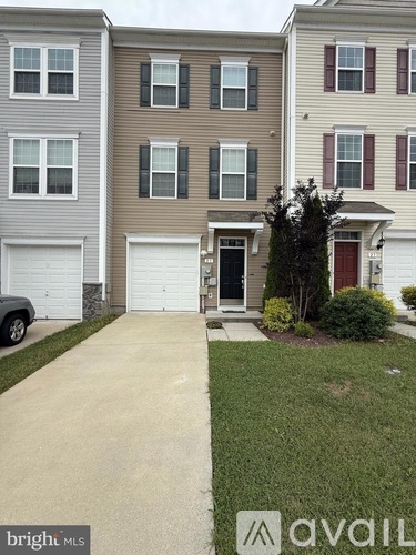 A house with a driveway in front of it.