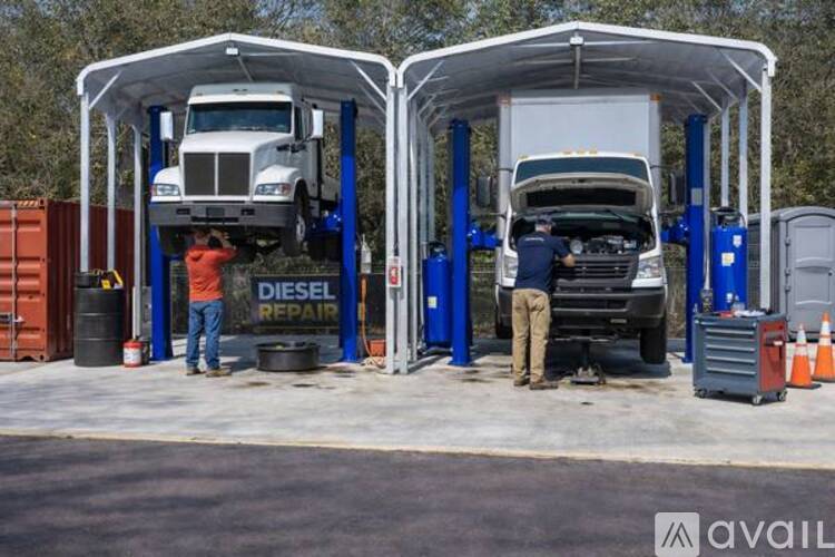 A truck is being serviced at a diesel repair station.
