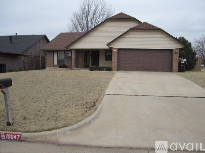 A house with a brown garage door is for sale.