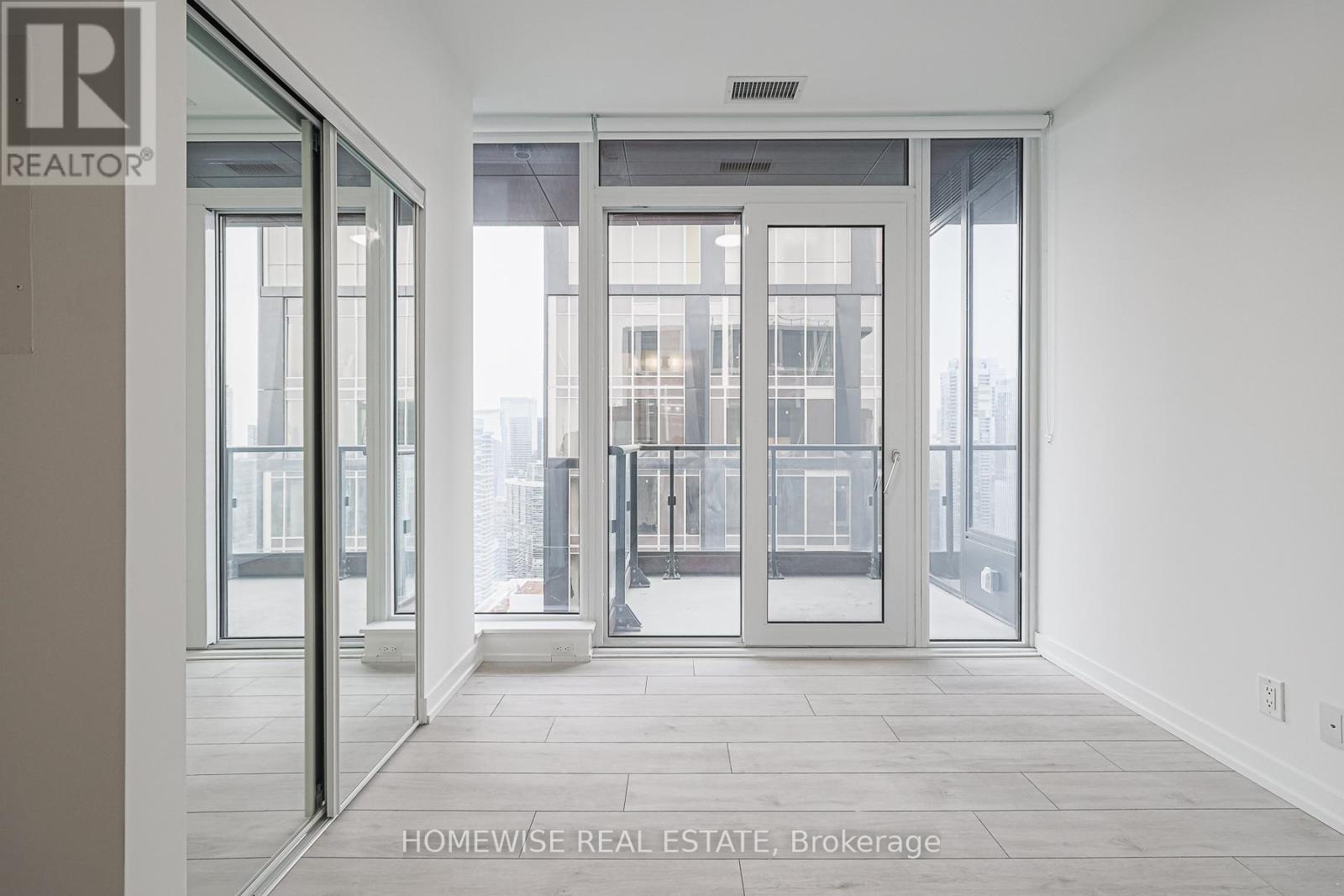 A real estate office with a glass door entrance.