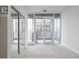 A real estate office with a glass door entrance.