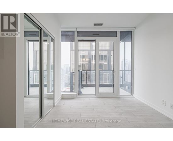 A real estate office with a glass door entrance.