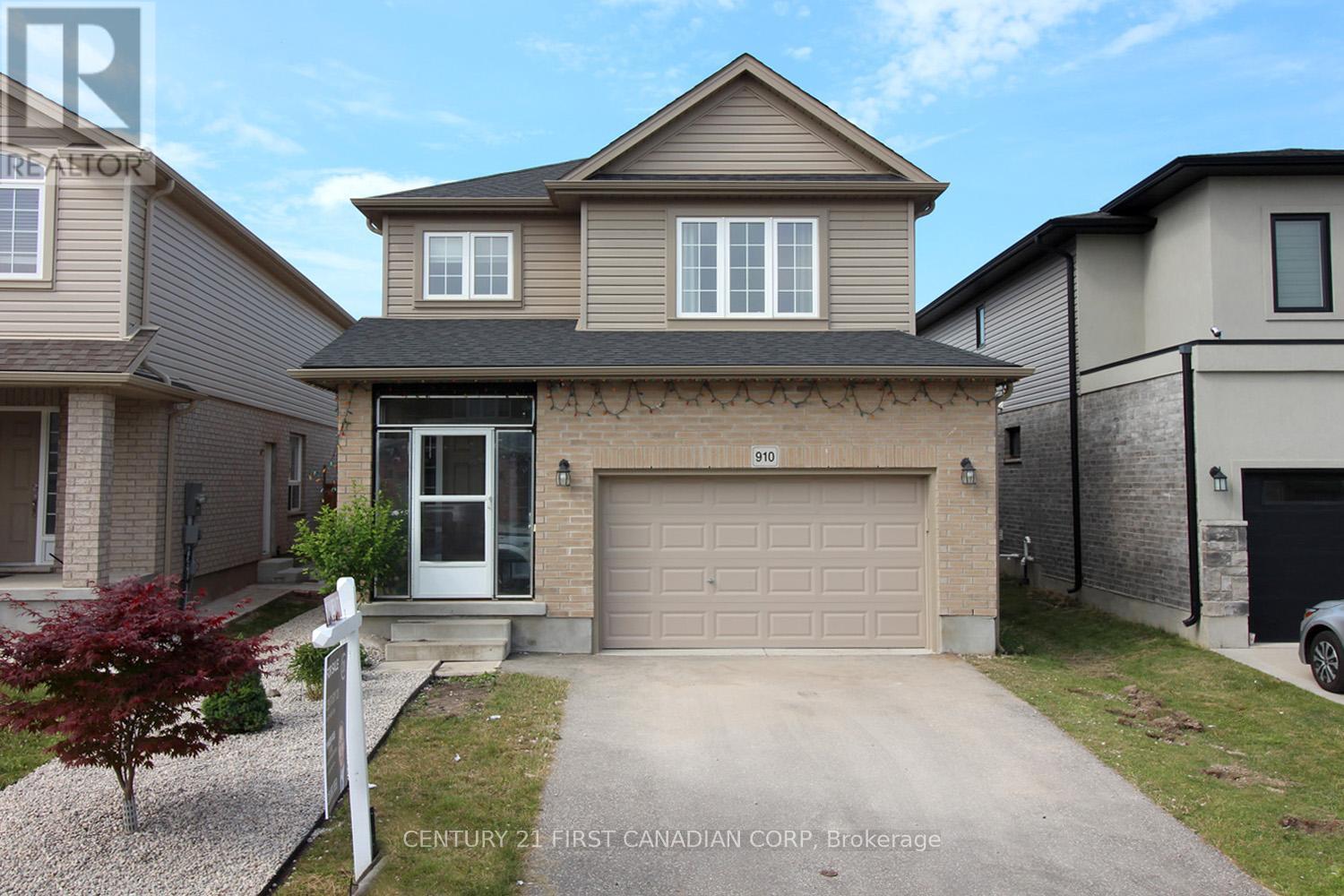 A two-story house with a garage is for sale.
