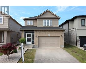 A two-story house with a garage is for sale.