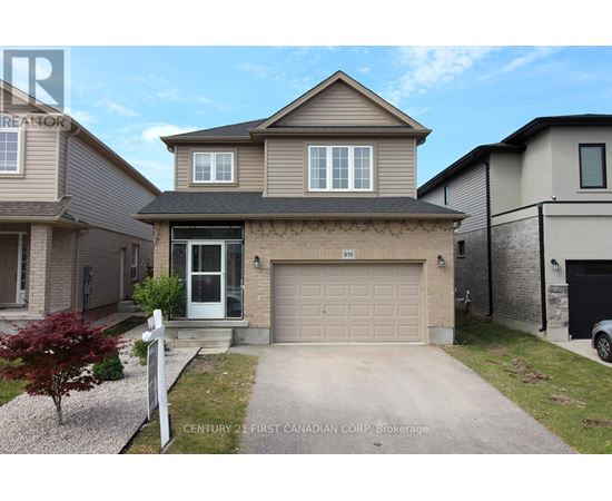 A two-story house with a garage is for sale.