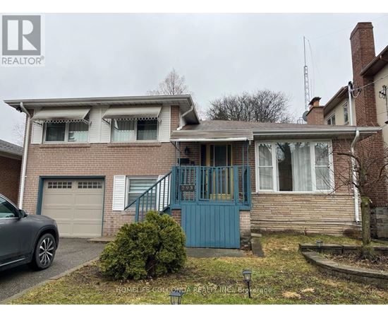 A house with a blue door and a grey car parked in front.