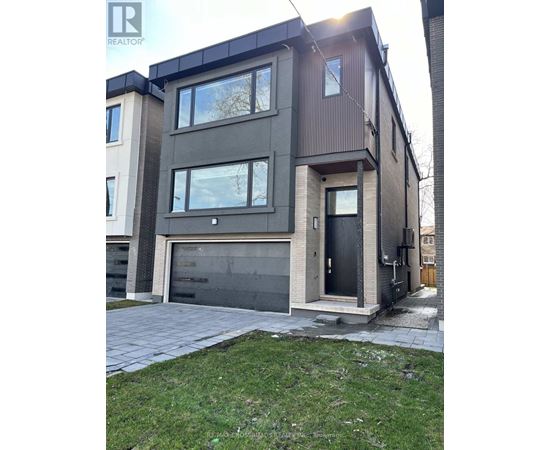 A modern two-story house with a garage is for sale.