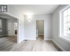 A room with a wooden floor and white walls.