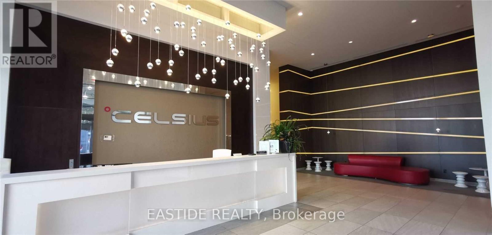 The lobby of a building with a reception desk and a sign that says "CELSIUS".