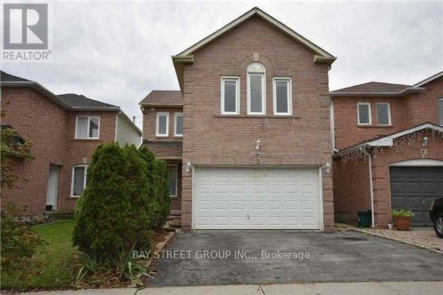 A house with a white garage door is for sale by Bay Street Group Inc. in Brokerage.