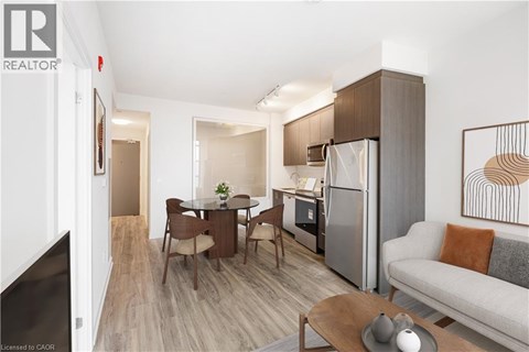 A modern living room with a dining table and chairs.