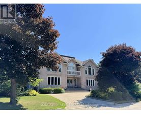A large house with a driveway in front of it.